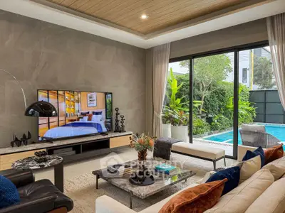 Luxurious living room with pool view, modern decor, and large TV, perfect for relaxation and entertainment.