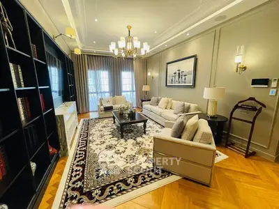 Luxurious living room with elegant decor, plush seating, and stylish lighting in a sophisticated home.