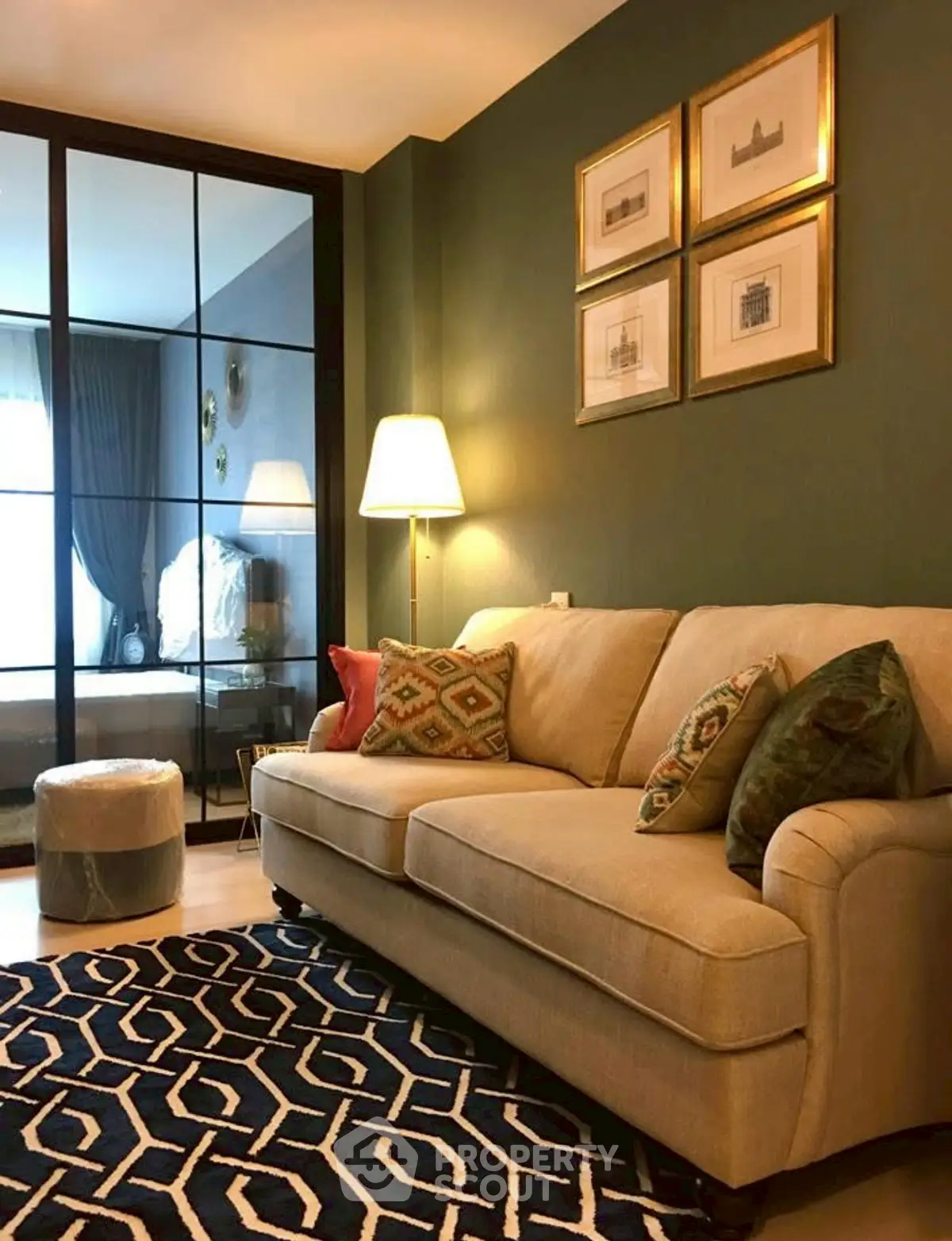 Stylish living room with elegant decor and cozy seating in modern apartment.