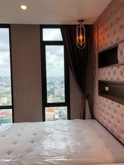 Luxurious bedroom with stunning city view and elegant decor