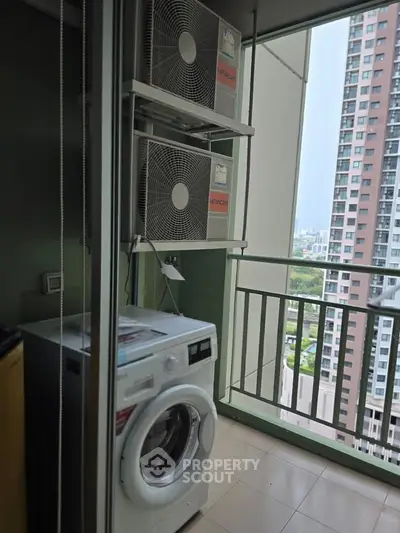 High-rise apartment balcony with washing machine and city view, perfect for urban living.
