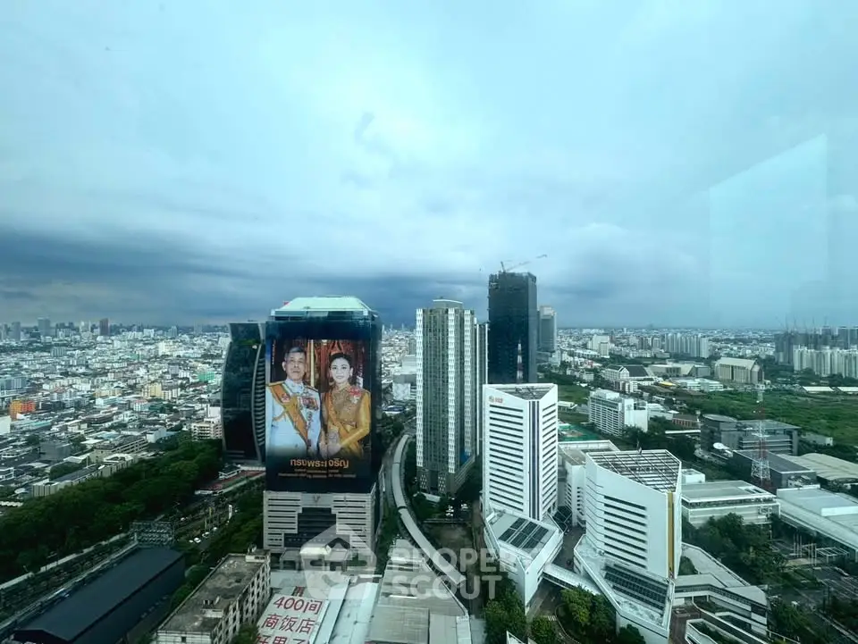 Stunning cityscape view from a high-rise building showcasing urban skyline and architecture.