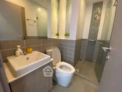 Modern bathroom with sleek design and glass shower enclosure