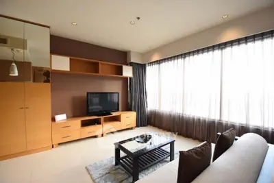 Modern living room with large windows and sleek furniture
