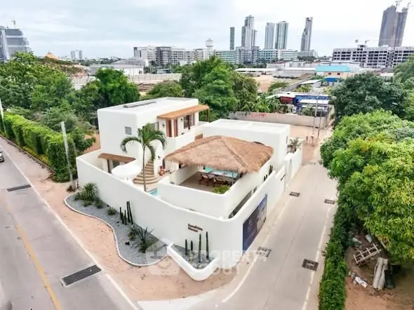 Stunning modern villa with rooftop terrace and lush greenery in prime urban location.