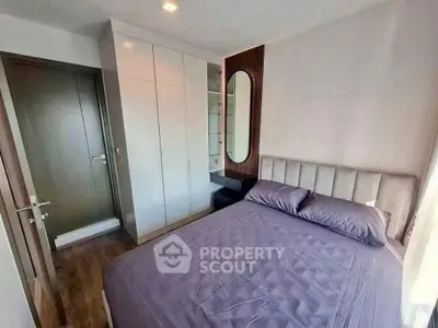 Modern bedroom with sleek wardrobe and stylish decor