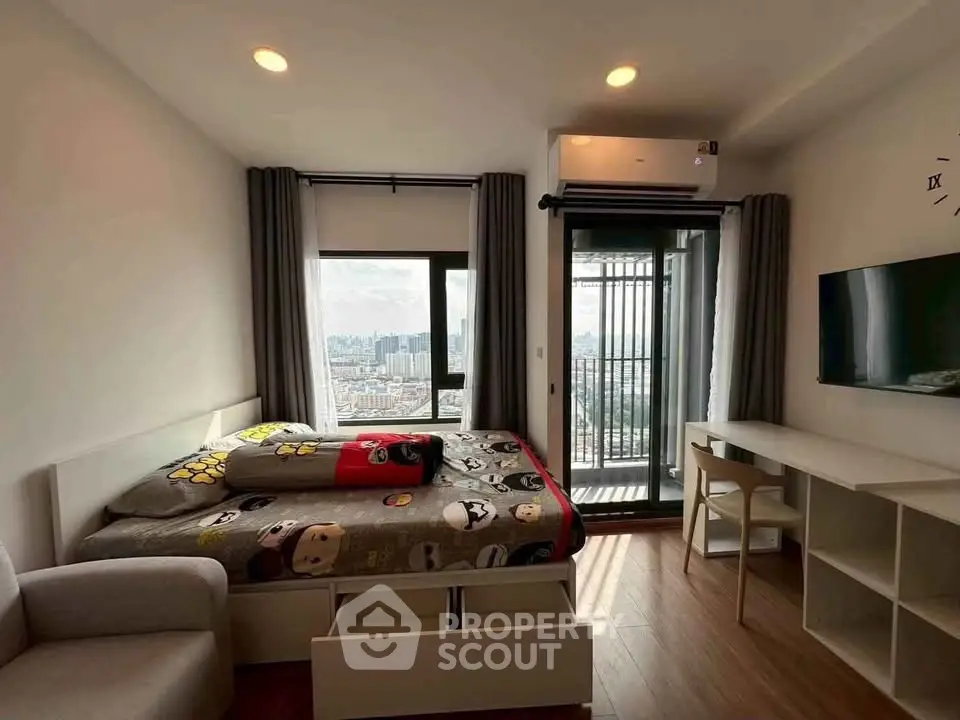 Modern bedroom with city view, featuring stylish furniture and a cozy atmosphere.