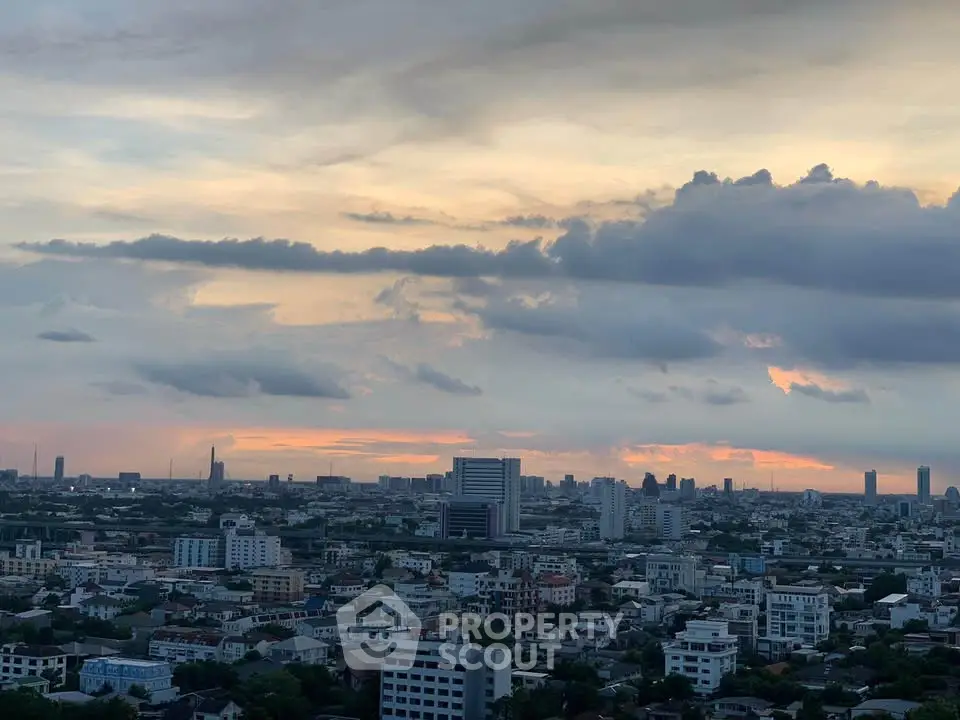 Stunning cityscape view at sunset showcasing urban skyline and vibrant clouds.