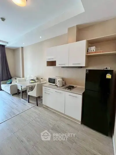 Modern open-layout kitchen with dining area and cozy living space