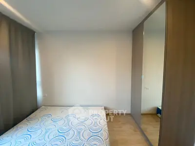 Cozy bedroom with minimalist design and large wardrobe