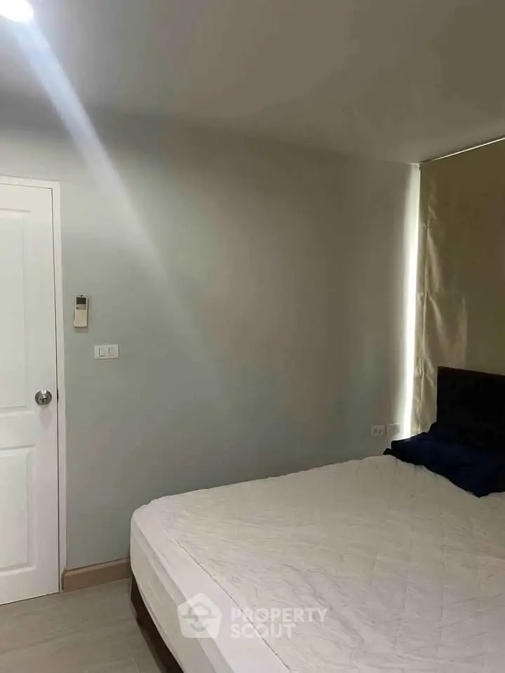 Cozy bedroom with minimalist decor and natural light