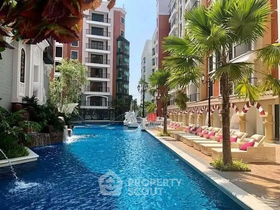 Luxurious apartment complex with stunning pool and palm trees
