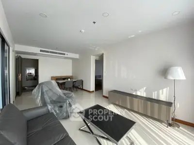 Spacious modern living room with sleek furniture and natural light