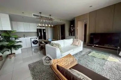 Luxurious open-plan living room with modern kitchen and stylish decor