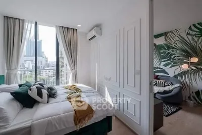 Modern bedroom with large windows and stylish decor in urban apartment