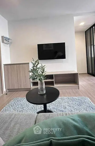 Modern living room with sleek TV setup and stylish decor