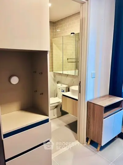 Modern bathroom with sleek fixtures and neutral tones in a contemporary apartment.