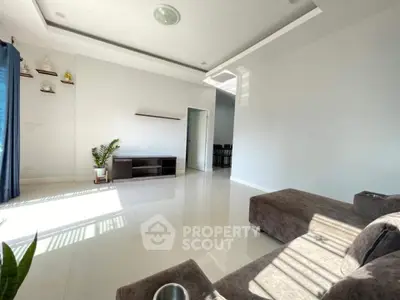 Spacious modern living room with sleek design and abundant natural light