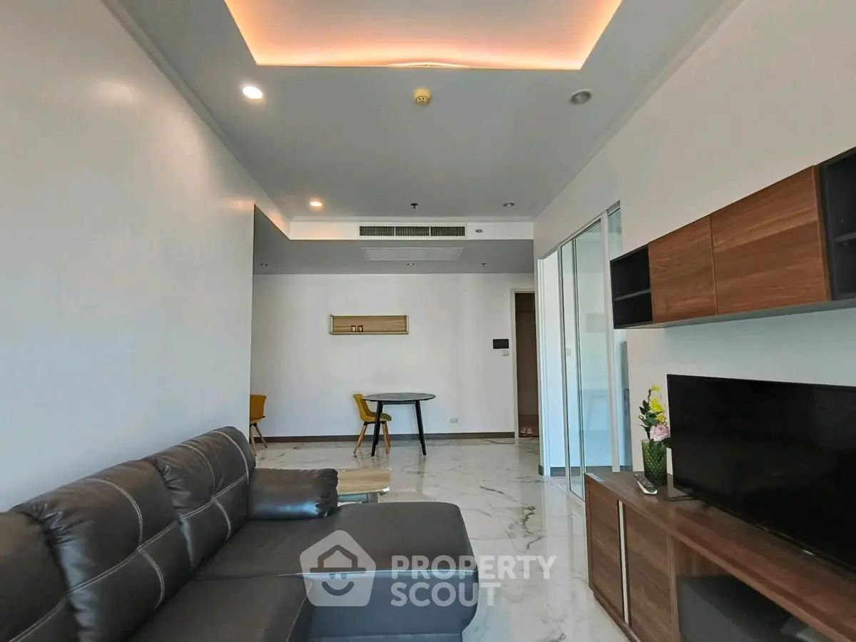 Modern living room with sleek furniture and elegant lighting