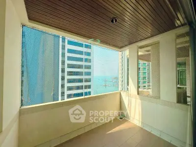 Spacious balcony with city view in modern high-rise apartment