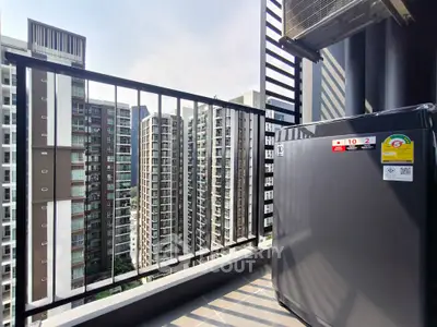 Modern balcony with cityscape view and sleek appliances