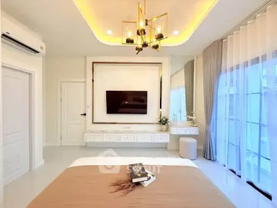 Luxurious modern bedroom with elegant lighting and large windows