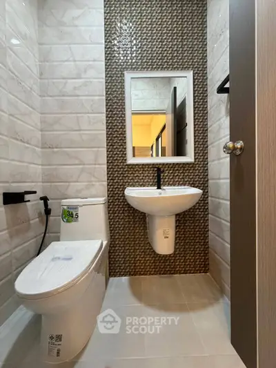 Modern bathroom with sleek fixtures and stylish tile design