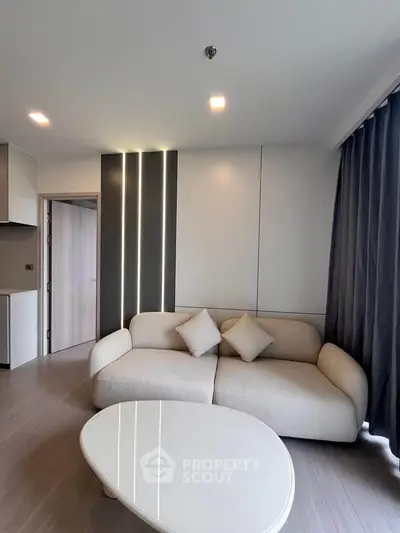 Modern living room with sleek design and cozy sofa