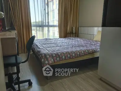 Cozy bedroom with large window and stylish decor