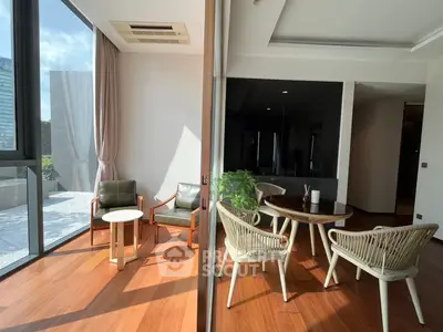 Spacious modern living area with large windows and stylish furniture