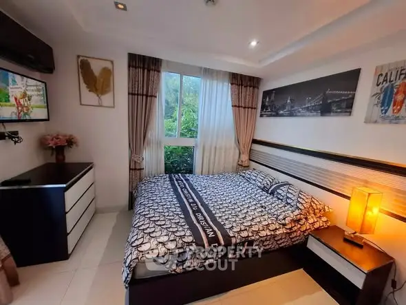 Cozy bedroom with modern decor and large window view