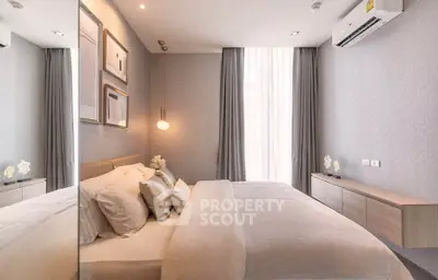 Luxurious bedroom with modern decor, elegant lighting, and a cozy ambiance perfect for relaxation.