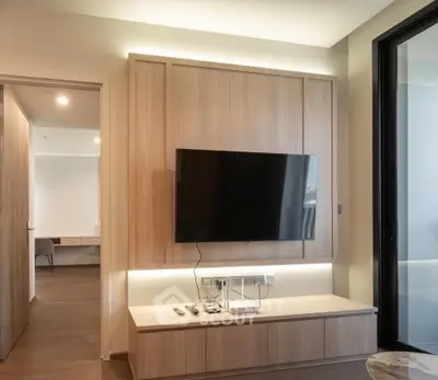 Modern living room with sleek TV setup and elegant wooden paneling