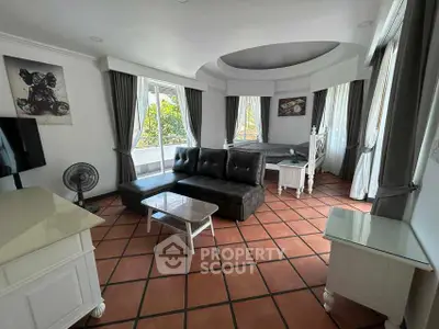 Spacious living room with elegant decor and ample natural light