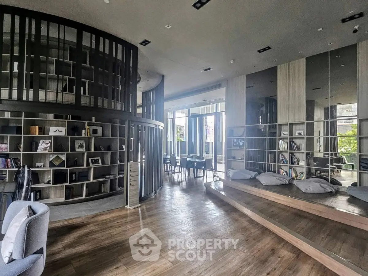 Modern library with stylish seating and bookshelves in a contemporary building