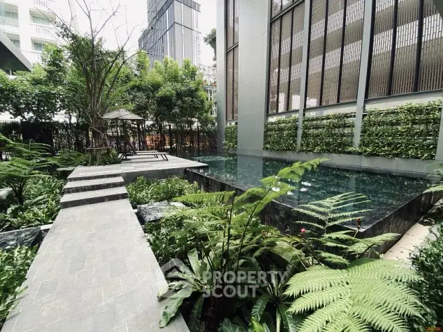 Luxurious garden with modern pool and lush greenery in urban setting
