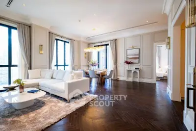 Luxurious open living room with elegant decor and hardwood floors in a high-end apartment.