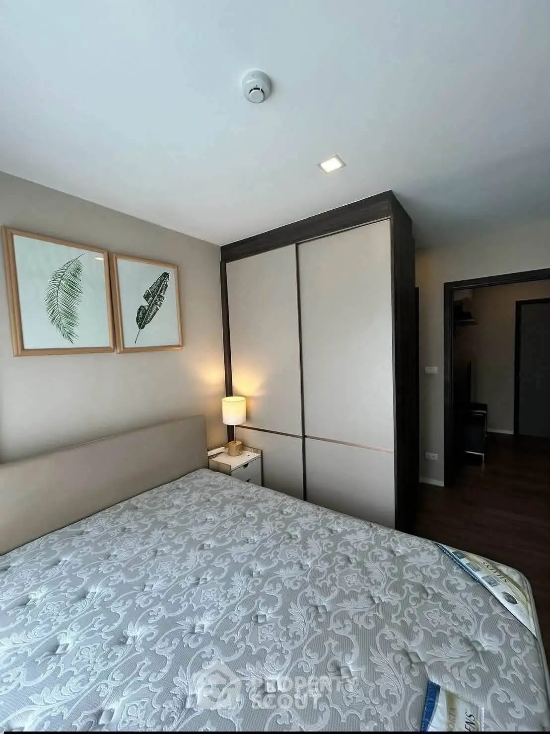 Modern bedroom with stylish decor and ample storage space