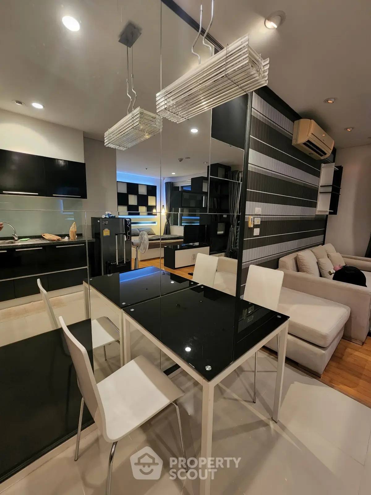 Modern living room with sleek dining area and stylish decor