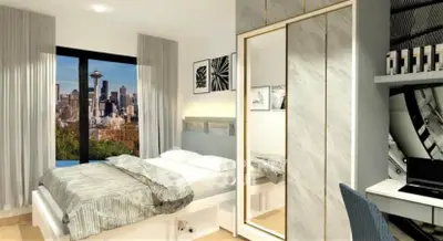 Modern bedroom with city skyline view, stylish decor, and mirrored wardrobe doors.