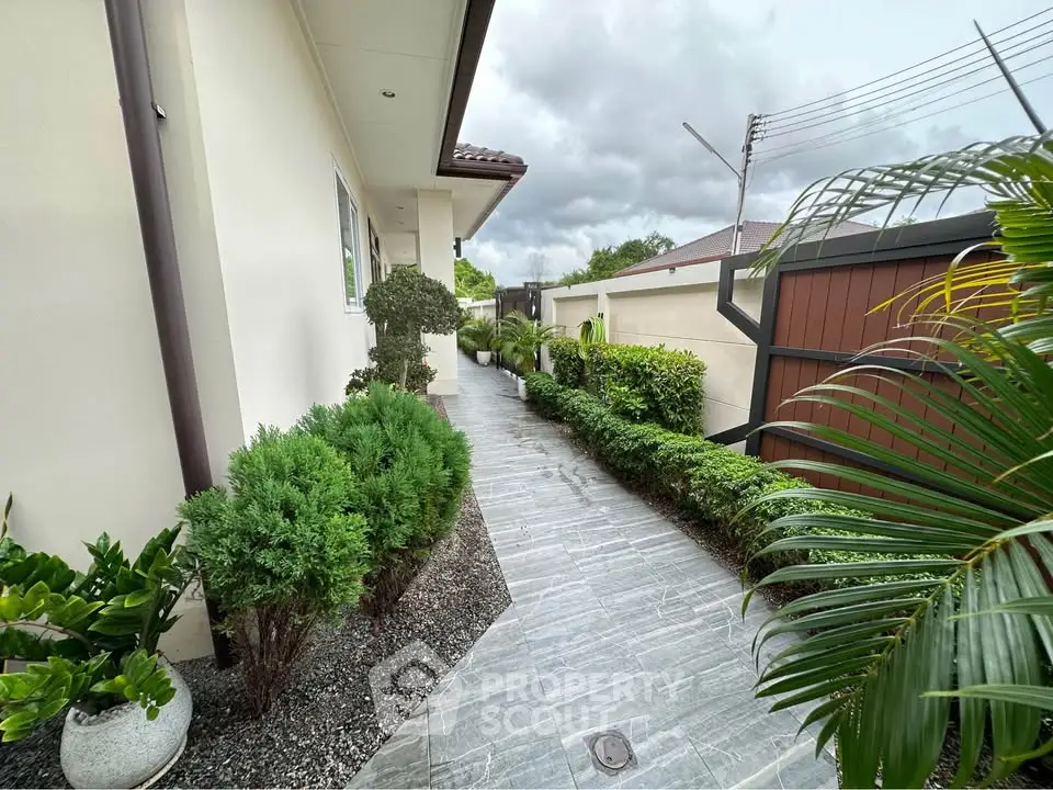 Charming garden pathway with lush greenery and modern exterior design