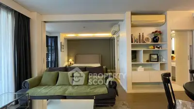 Modern studio apartment with stylish decor and open layout, featuring a cozy living area and elegant bedroom.