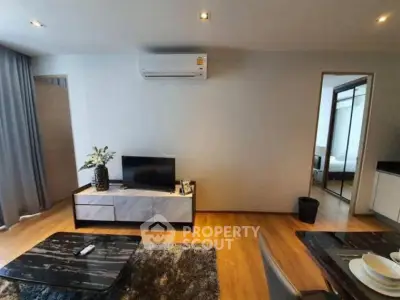 Modern living room with sleek furniture and air conditioning in a stylish apartment.