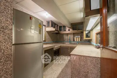 Spacious kitchen with granite countertops and modern appliances