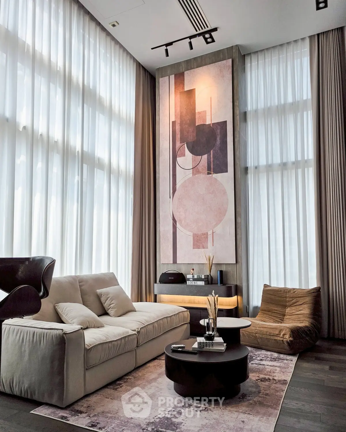 Luxurious modern living room with high ceilings and elegant decor