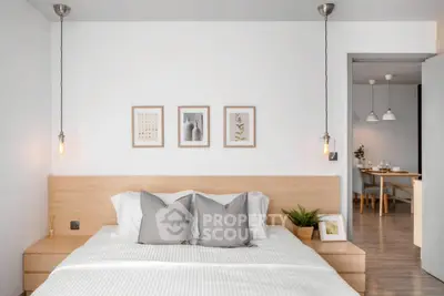 Modern bedroom with minimalist decor and stylish pendant lighting