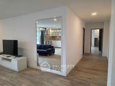 Modern open-plan living room with sleek kitchen and stylish decor