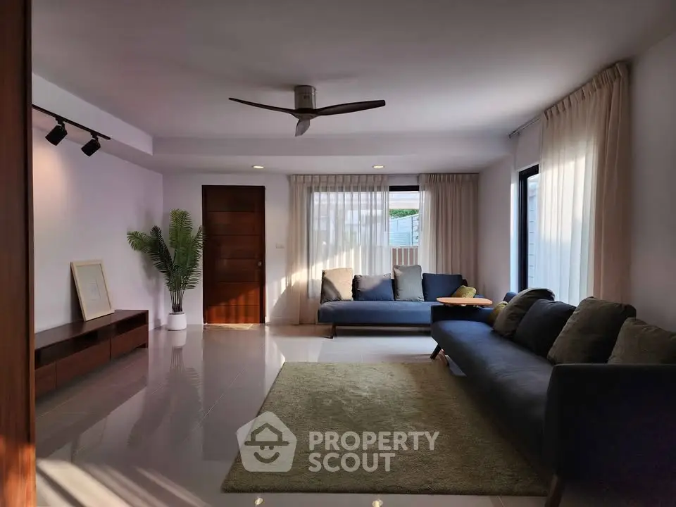 Spacious modern living room with elegant decor and natural light