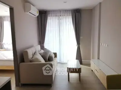 Modern living room with cozy sofa and natural light