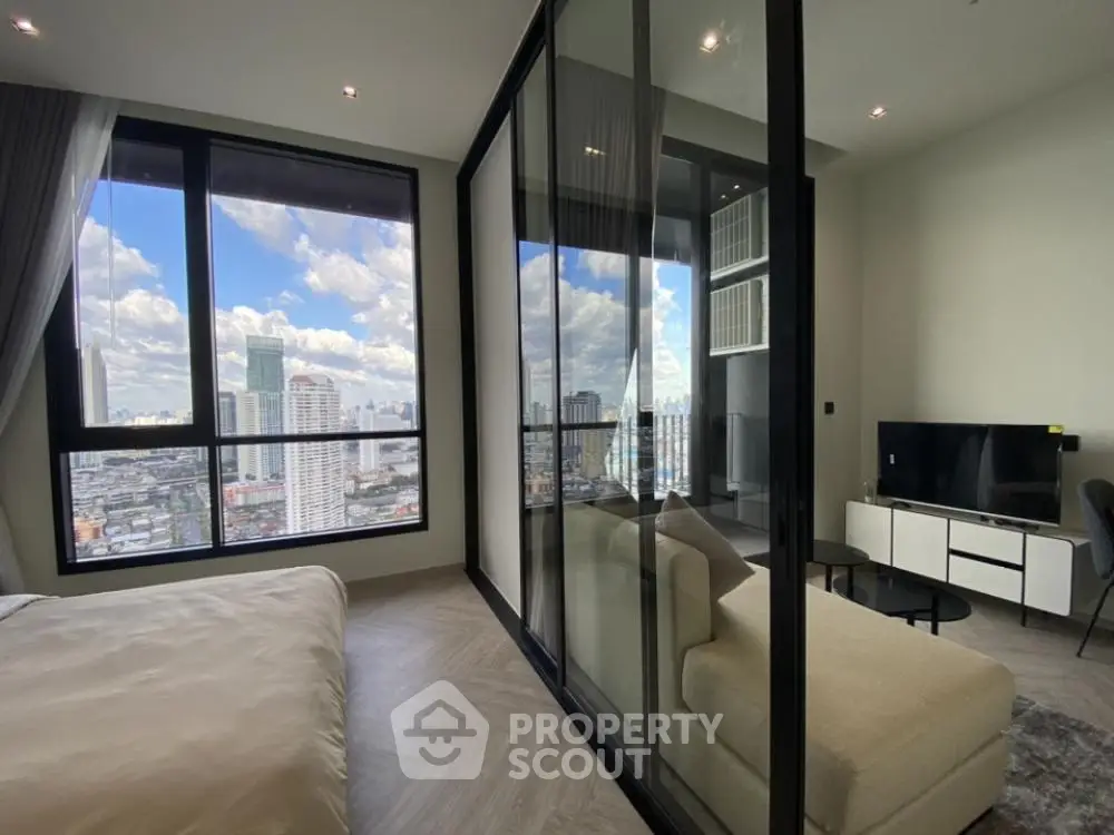 Modern high-rise apartment with stunning city view and sleek interior design
